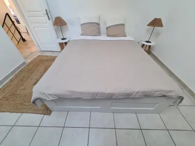 Un ou plusieurs lits dans un hébergement de l'établissement Casa Papidou, Charmante Maison au calme