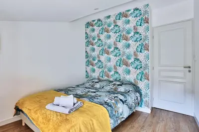 Un ou plusieurs lits dans un hébergement de l'établissement le karibu appartement confort tout équipé