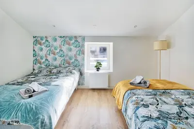 Un ou plusieurs lits dans un hébergement de l'établissement le karibu appartement confort tout équipé