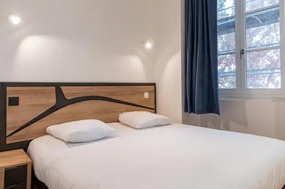 Un ou plusieurs lits dans un hébergement de l'établissement Croix Paquet - Appartements à Lyon