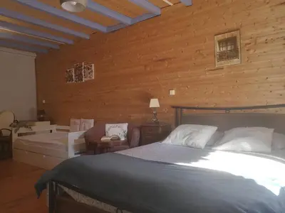 Un ou plusieurs lits dans un hébergement de l'établissement Mimi Pinson Maison cosy style chalet