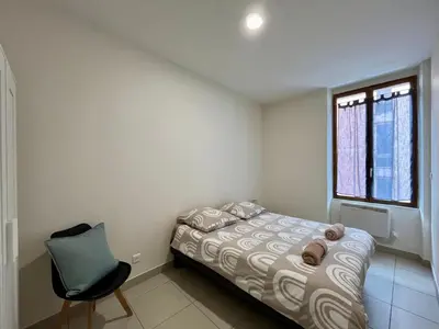 Un ou plusieurs lits dans un hébergement de l'établissement Bel appartement à 15 min de Lyon