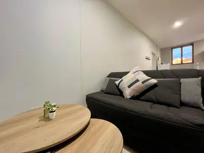 Coin salon dans l'établissement Bel appartement à 15 min de Lyon