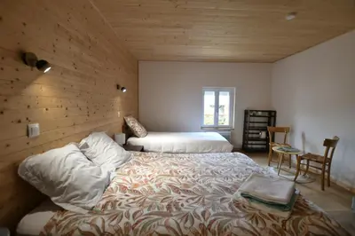 Un ou plusieurs lits dans un hébergement de l'établissement Chambre d'hôte L'Oiseau Blanc