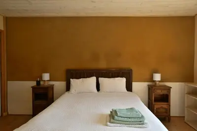 Un ou plusieurs lits dans un hébergement de l'établissement Chambre d'hôte L'Oiseau Blanc