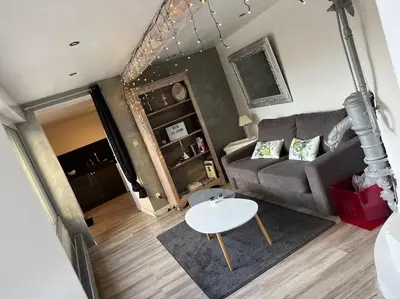 Coin salon dans l'établissement Appartement de caractère