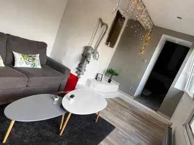 Coin salon dans l'établissement Appartement de caractère