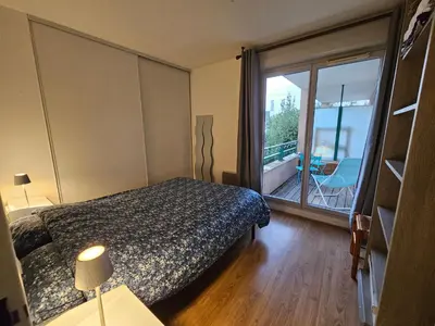 Un ou plusieurs lits dans un hébergement de l'établissement Appartement de charme, Garage, Terrasse, Piscine