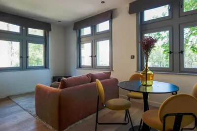 Coin salon dans l'établissement HONORÊ SUITE VUE SAONE