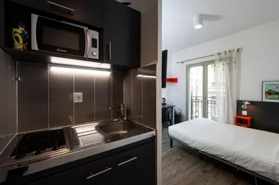 Cuisine ou kitchenette dans l'établissement Résilodge Lyon 2