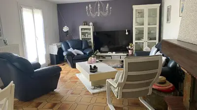 Coin salon dans l'établissement Chambres Quiétude