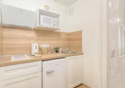 Cuisine ou kitchenette dans l'établissement LOUISE - Studio de qualité et très cozy