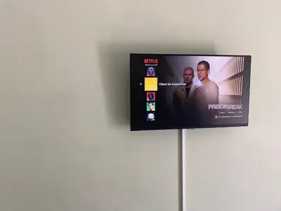 Télévision ou salle de divertissement dans l'établissement De Tussenstop