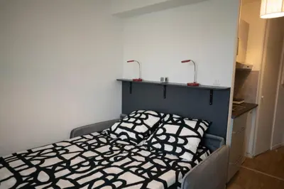 Un ou plusieurs lits dans un hébergement de l'établissement Cosy Studio 16m2