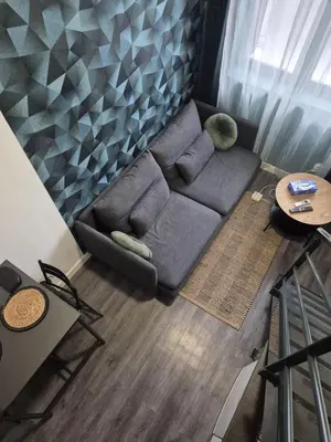 Coin salon dans l'établissement Studio mezzanine Lyon