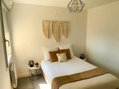 Un ou plusieurs lits dans un hébergement de l'établissement Appartement Les Hauts du Beaujolais