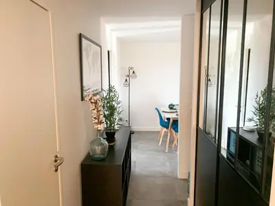 Télévision ou salle de divertissement dans l'établissement Appartement Les Hauts du Beaujolais