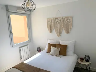 Un ou plusieurs lits dans un hébergement de l'établissement Appartement Les Hauts du Beaujolais