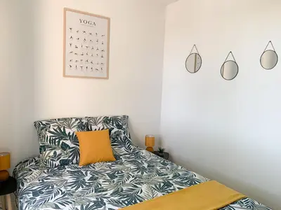 Un ou plusieurs lits dans un hébergement de l'établissement Appartement Les Hauts du Beaujolais