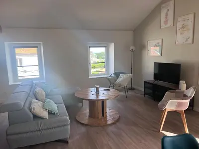 Télévision ou salle de divertissement dans l'établissement Gîte Anna