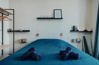 Un ou plusieurs lits dans un hébergement de l'établissement Superbe appartement lyonnais, vue sur Saône