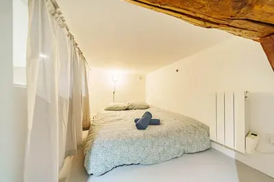 Un ou plusieurs lits dans un hébergement de l'établissement Le loft Montesquieu spacieux 6 pers Saxe Gambetta
