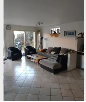 Coin salon dans l'établissement Chambre souriante
