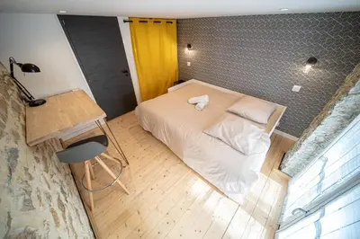 Un ou plusieurs lits dans un hébergement de l'établissement Spacious Loft in La Guillotière 2 Bedrooms Lyon 7