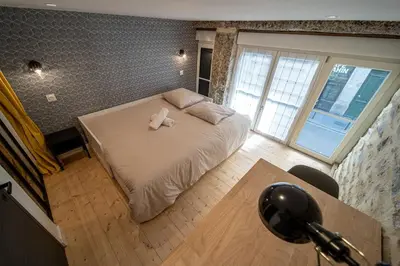 Un ou plusieurs lits dans un hébergement de l'établissement Spacious Loft in La Guillotière 2 Bedrooms Lyon 7