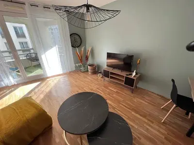 Coin salon dans l'établissement appartement avec jaccuzzi 15 min du centre de lyon