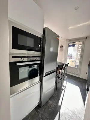 Cuisine ou kitchenette dans l'établissement Appartement 3 chambres - Proche metro