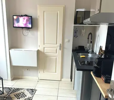 Cuisine ou kitchenette dans l'établissement L'Oasis Cosy