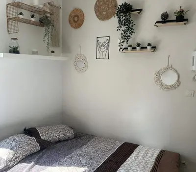 Un ou plusieurs lits dans un hébergement de l'établissement L'Oasis Cosy