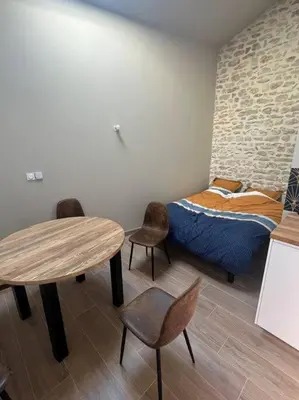 Un ou plusieurs lits dans un hébergement de l'établissement Studio 25m2 neuf
