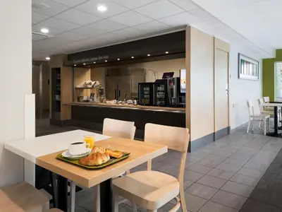 Cuisine ou kitchenette dans l'établissement B&B HOTEL Lyon Sud États-Unis