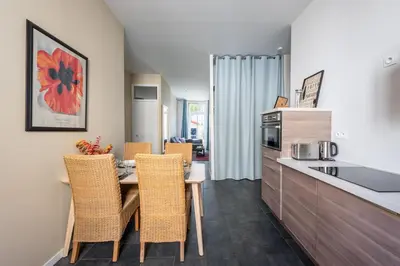 Cuisine ou kitchenette dans l'établissement Le Jardin des Docks - Appt avec jardin