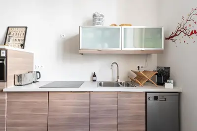 Cuisine ou kitchenette dans l'établissement Le Jardin des Docks - Appt avec jardin