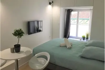 Un ou plusieurs lits dans un hébergement de l'établissement Studio Duquesne - Parc Tête d'Or-Metro Fochoch