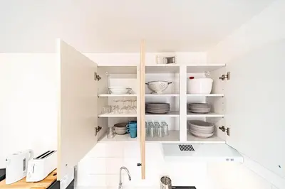 Un ou plusieurs lits dans un hébergement de l'établissement Le petit Montel- studio avec garage-métro Valmy