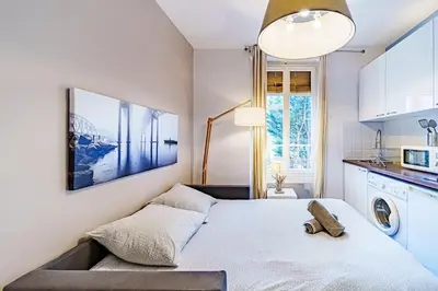 Un ou plusieurs lits dans un hébergement de l'établissement Le petit Delore - Studio 2 personnes - Lyon 8