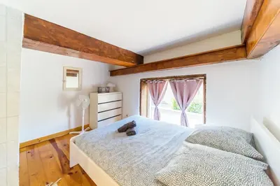 Un ou plusieurs lits dans un hébergement de l'établissement The charming Fleury 2 bedrooms Oullins