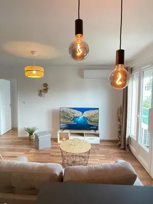 Coin salon dans l'établissement Bel appartement Meyzieu centre proche Tramway