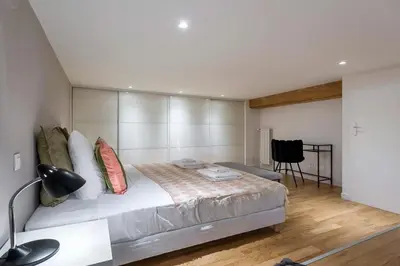 Un ou plusieurs lits dans un hébergement de l'établissement Charlie - Furnished apartment 260m² Downtown Lyon