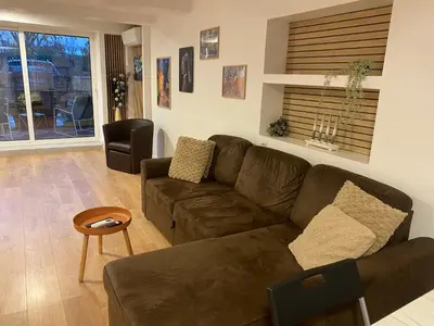 Coin salon dans l'établissement Appartement climatisé proche Eurexpo Groupama