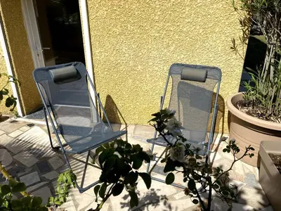 Coin salon dans l'établissement Appartement climatisé proche Eurexpo Groupama