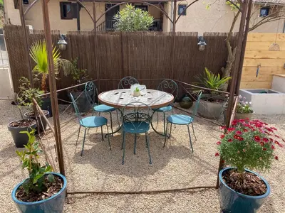 Jardin de l'établissement Maison sur cour et véranda