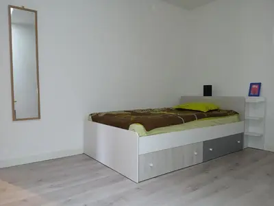 Un ou plusieurs lits dans un hébergement de l'établissement Appartement Golf Confort 83 m2