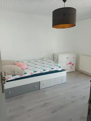 Un ou plusieurs lits dans un hébergement de l'établissement Appartement Golf Confort 83 m2