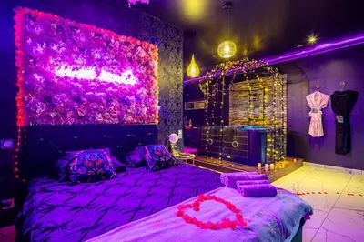 Un ou plusieurs lits dans un hébergement de l'établissement Sweet SECRET'S JACUZZI
