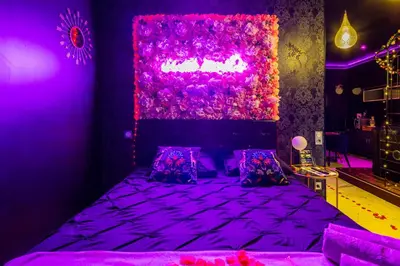 Un ou plusieurs lits dans un hébergement de l'établissement Sweet SECRET'S JACUZZI